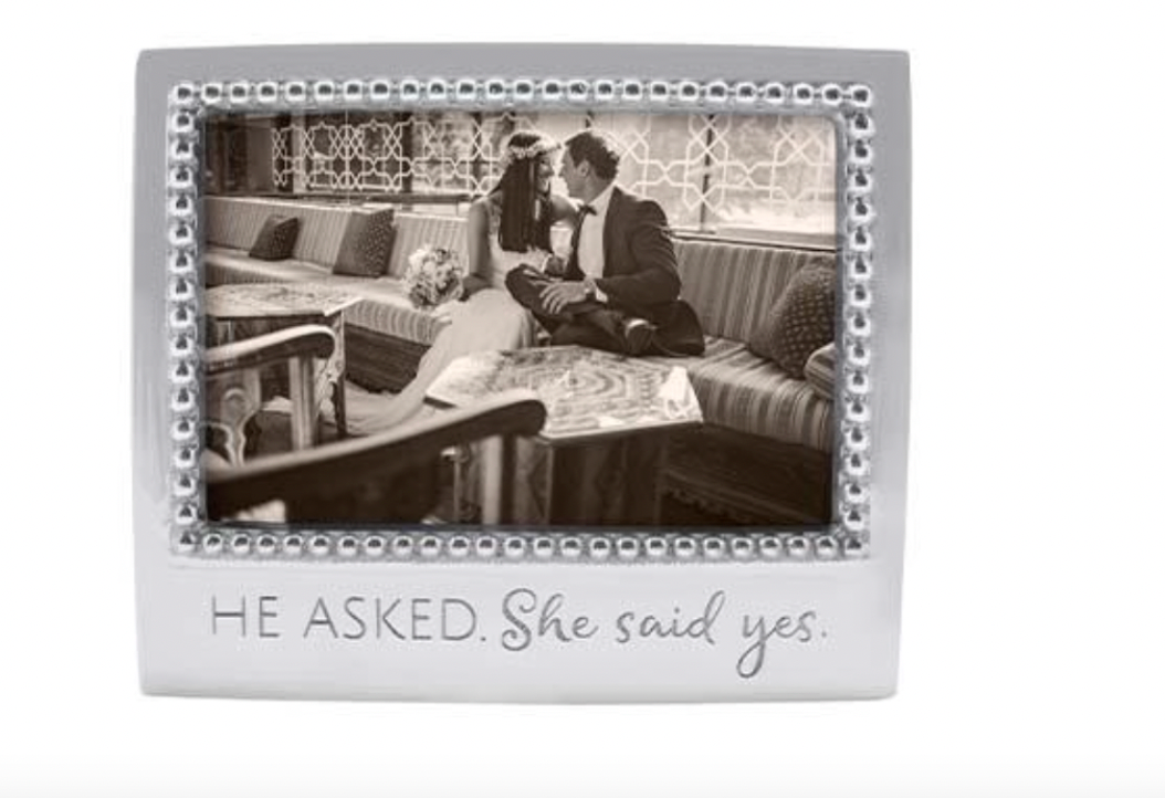 He asked She said yes